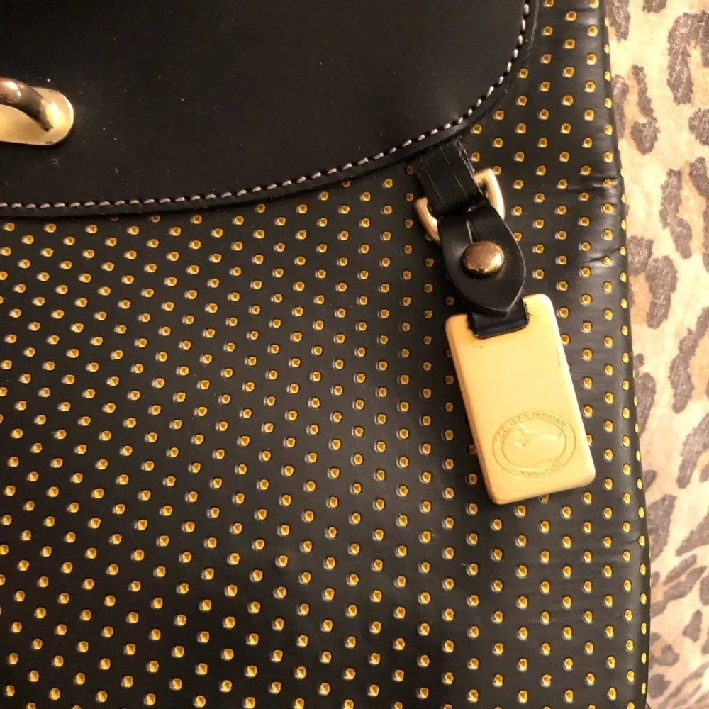 Dooney & Bourke Cabrio black leather laser cut w/ tag & serial number, vintage